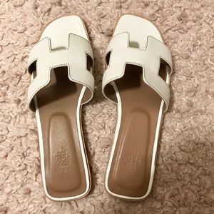 White Oran slip on sandals